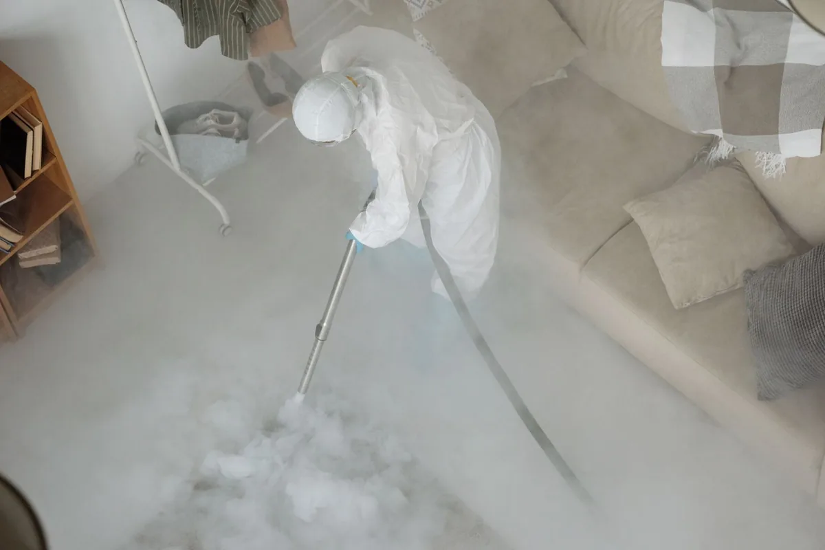 Biohazard cleanup technician in protective equipment, Janesville, WI